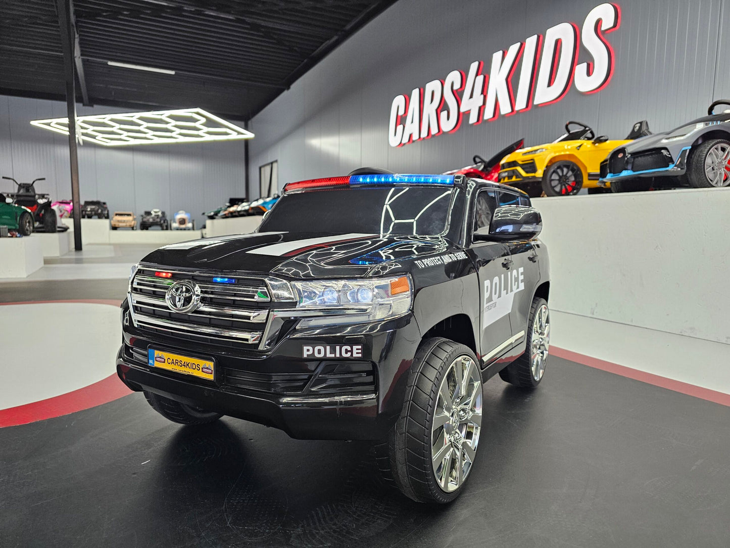 Kinderauto Toyota Land Cruiser politie 24 volt