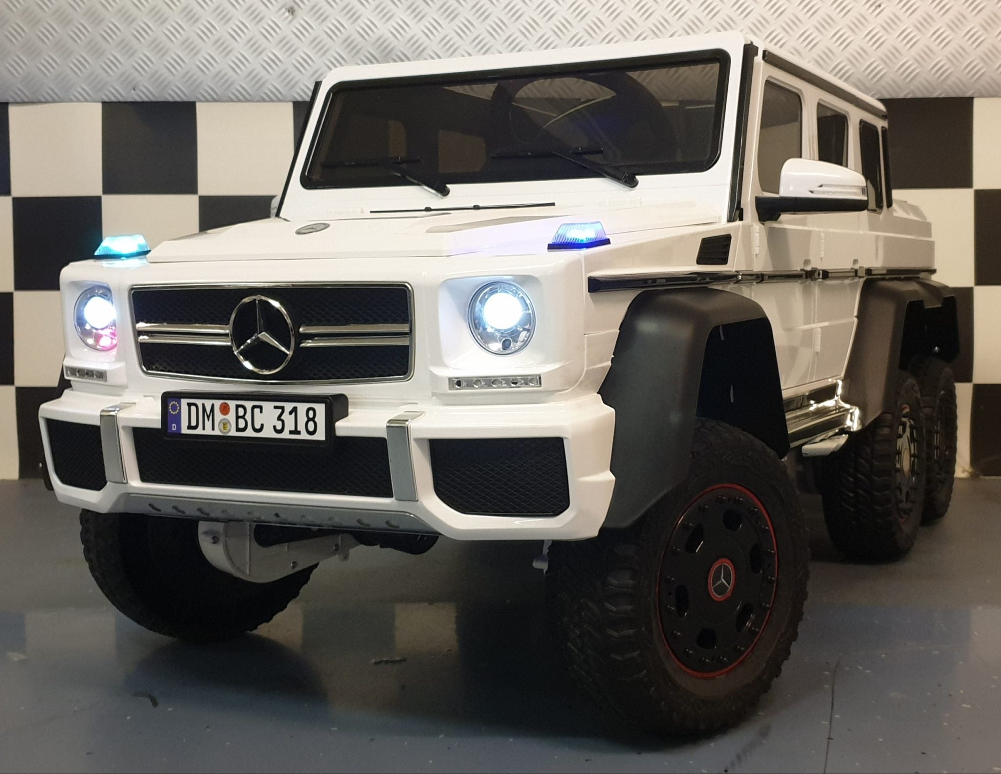 Kinderauto Mercedes AMG G63 6x6 met MP4 12V wit 1 pers