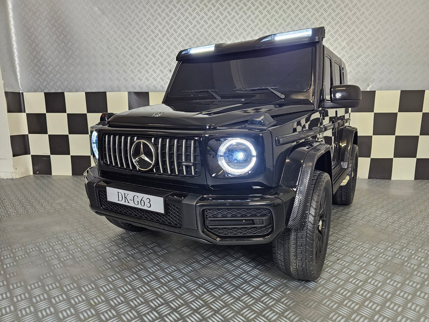 Kinderauto Mercedes G63 AMG 4x4 24 volt 2 persoons metallic zwart