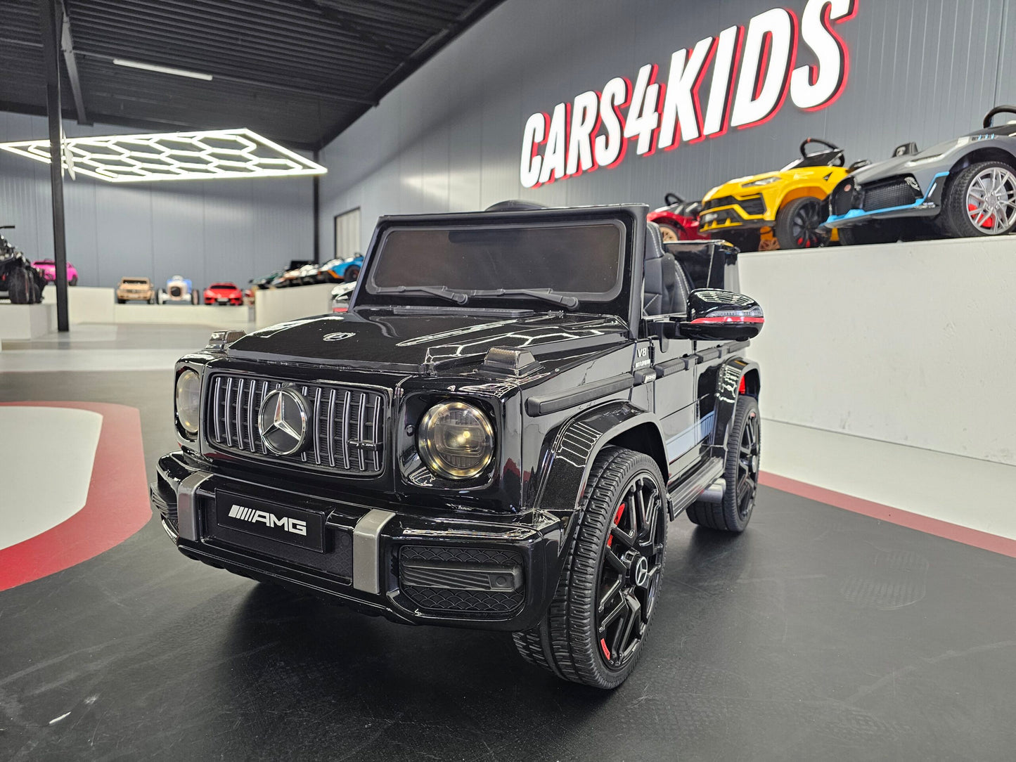 Kinderauto Mercedes G63 12V zwart met soft start 1 persoons